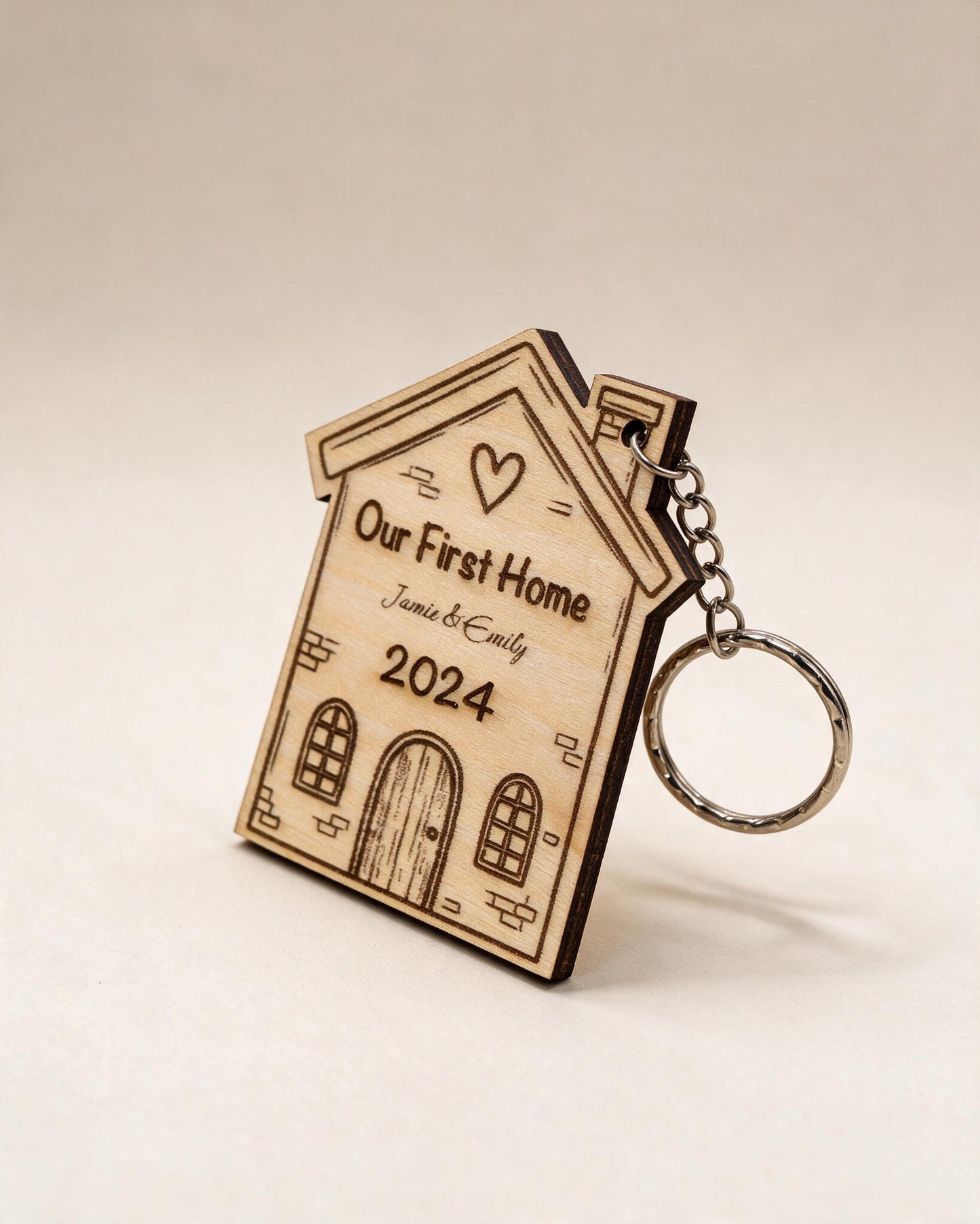 Personalised First Home wooden keyring on a neutral catalogue background