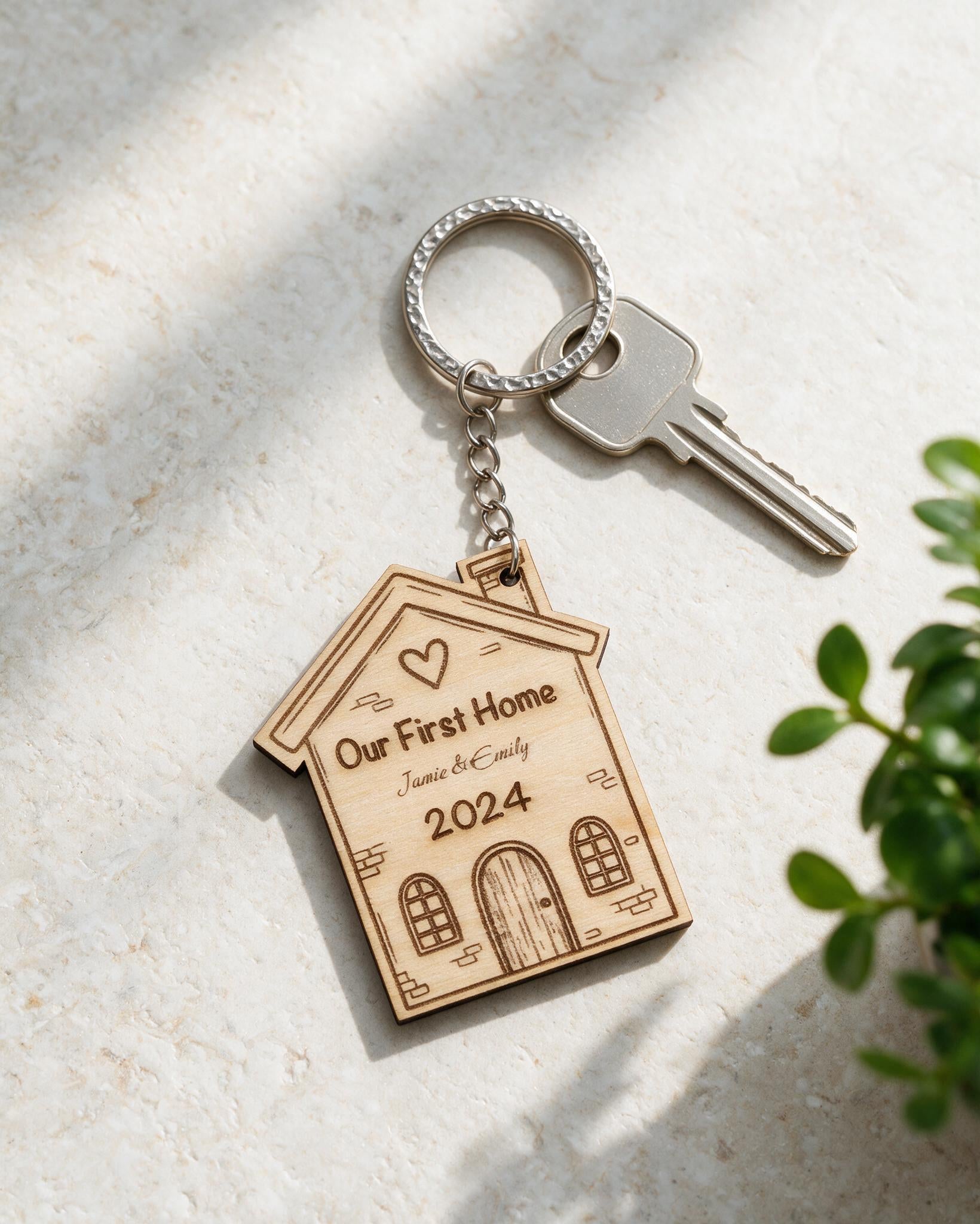 Personalised First Home wooden keyring in a sunlit tabletop scene