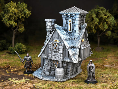 Unpainted Elderberry Cottage 28mm terrain with scale miniatures shown for context; miniatures not included