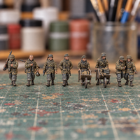 Iron Advance Marching Squad. Painted display example. Supplied unpainted. Background items not included.
