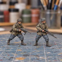 Iron Advance Flame two-figure team. Slapchop-painted display example. Supplied unpainted. Background items not included.