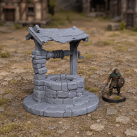 Old Well unpainted grey 28mm terrain in a medieval tabletop scene
