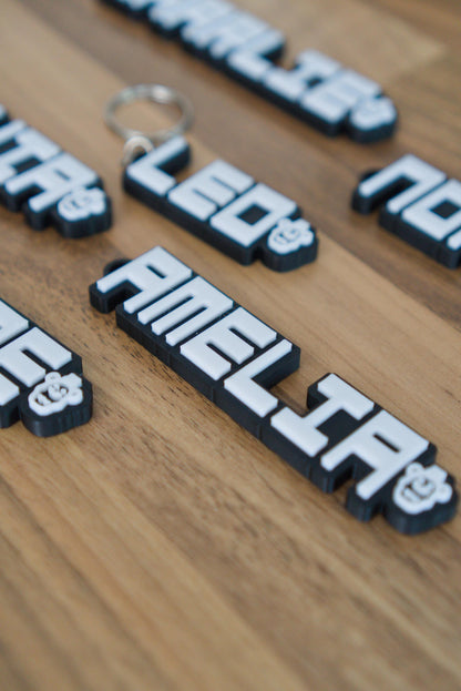FNAF custom name keychain on wooden background