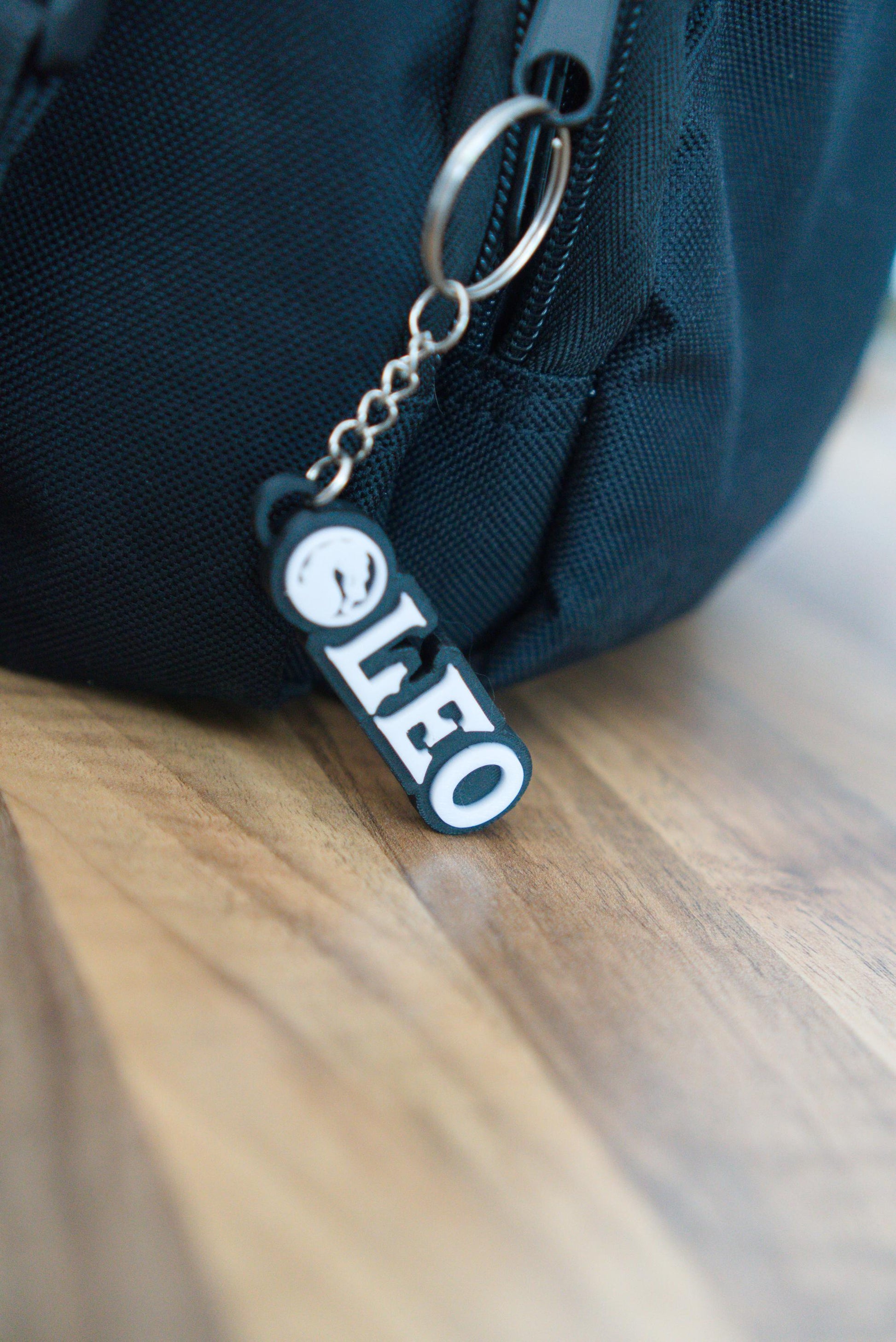 Personalised Mortal Kombat name keychain shown clipped to bag