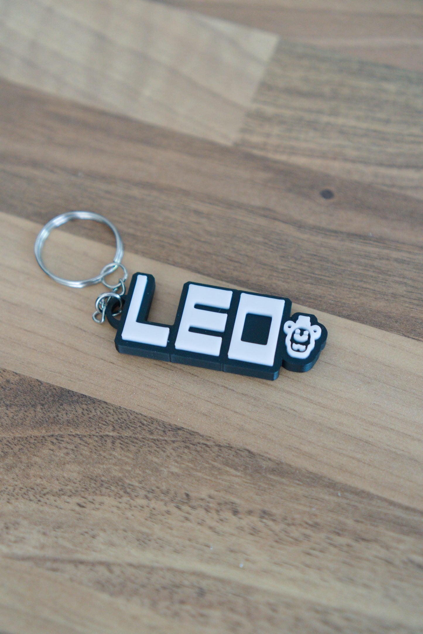 Personalised FNAF name keychain in black and white with Freddy character