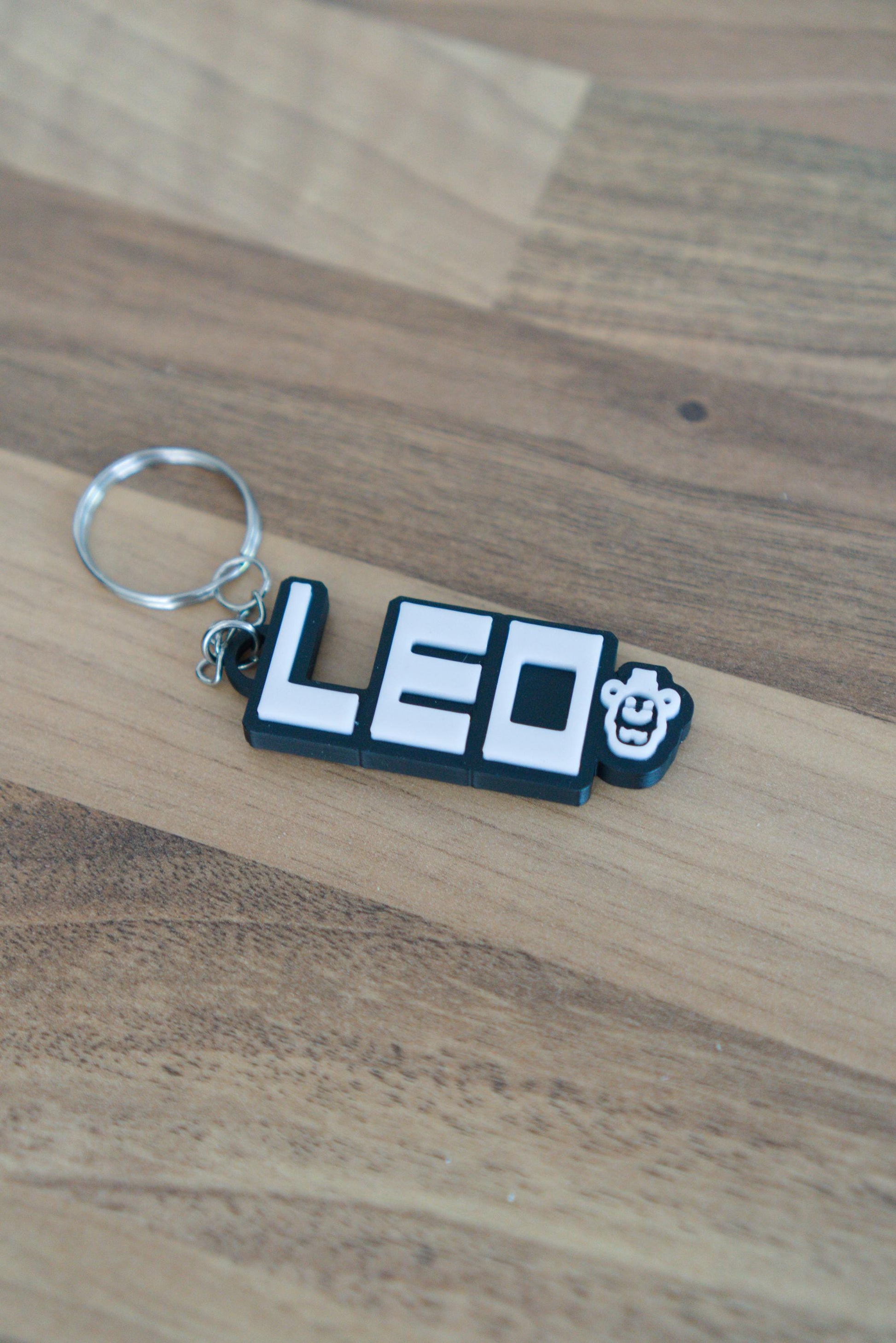 Personalised FNAF name keychain in black and white with Freddy character