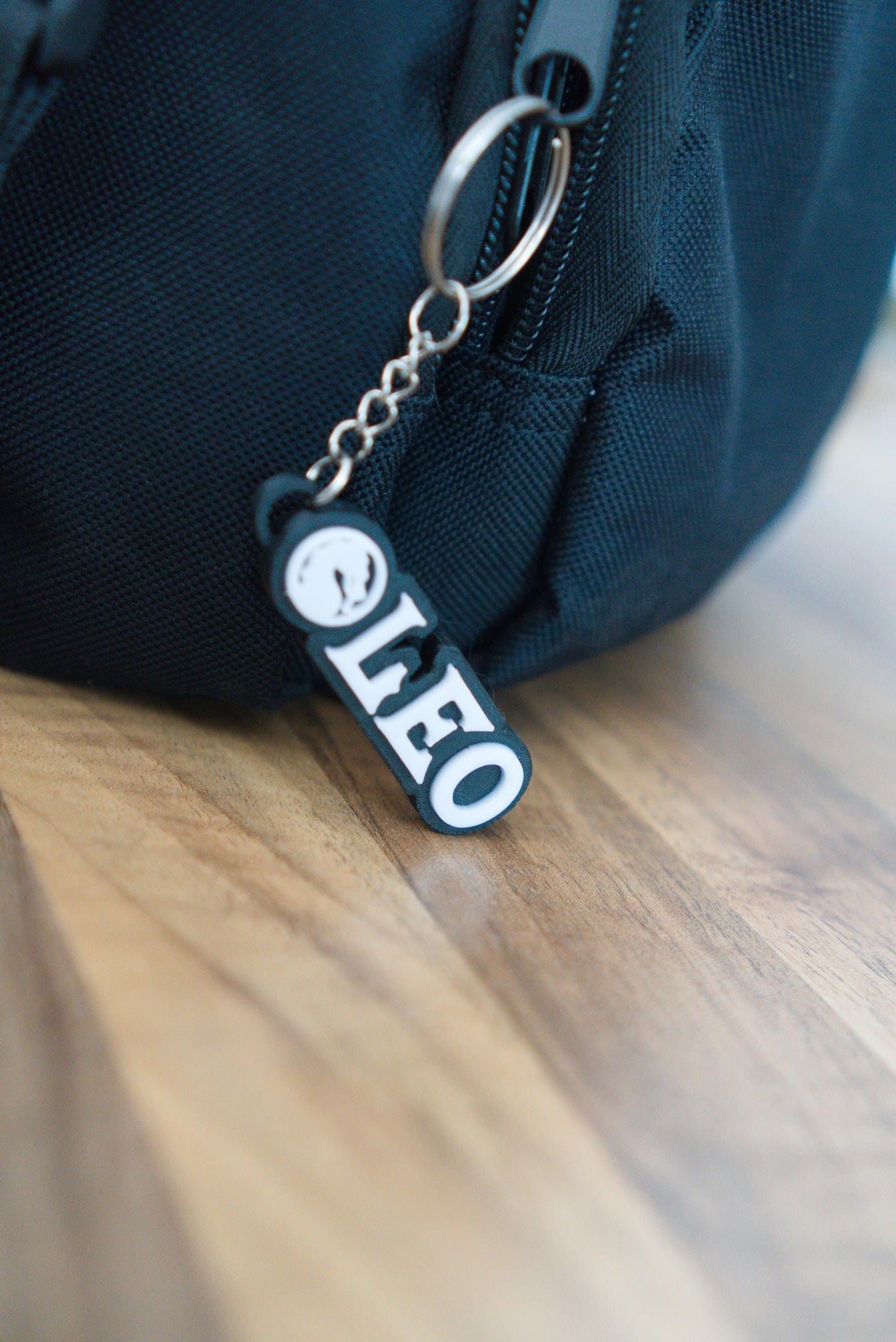 Personalised Mortal Kombat name keychain shown clipped to bag