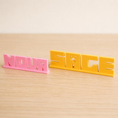 Small and Large Nova block letter personalised nameplates shown together for size comparison.