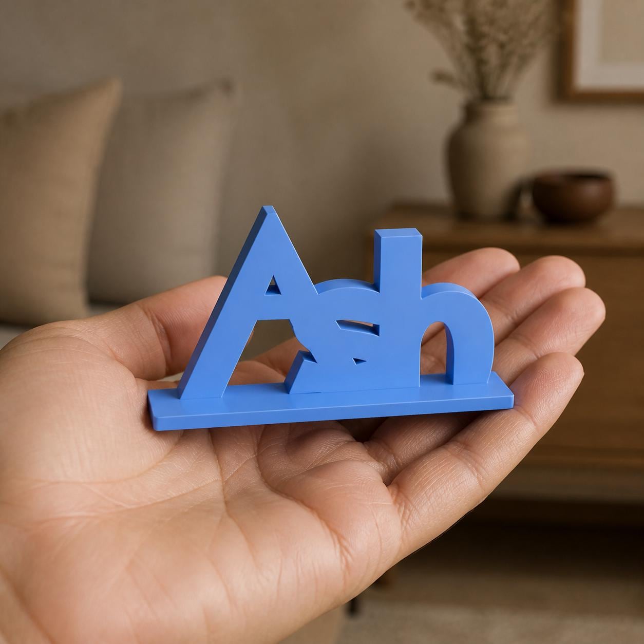Eevee creature adventure personalised nameplate held in an adult hand to demonstrate scale.