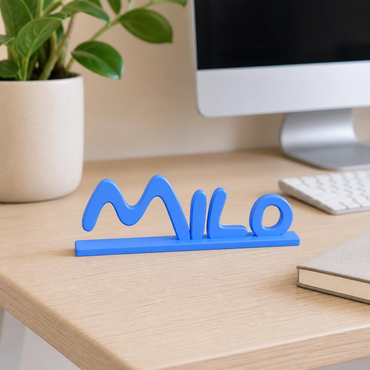 Milo cartoon style personalised nameplate displayed on a modern home-office desk.