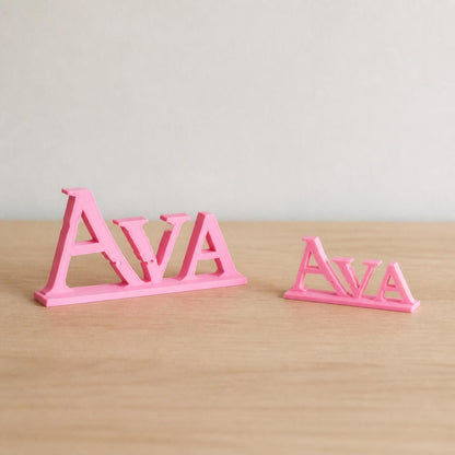 Small and Large Ava epic fantasy personalised nameplates shown together for size comparison.