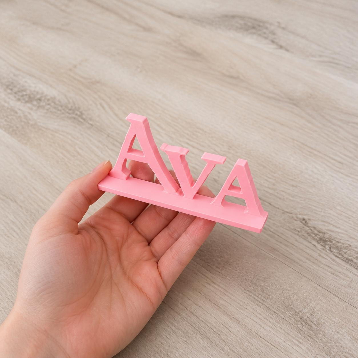 Ava epic fantasy personalised nameplate held in an adult hand to demonstrate scale.