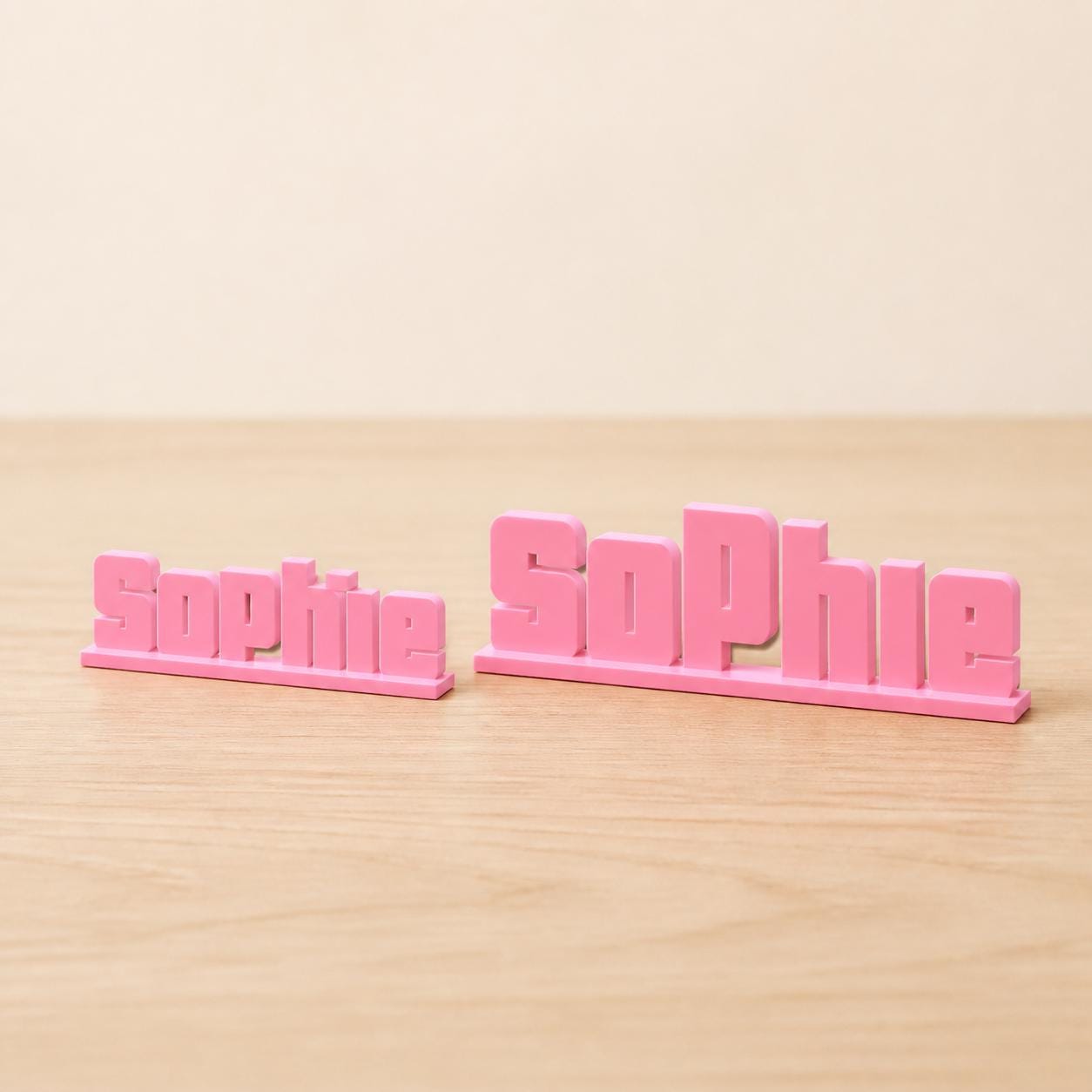 Small and Large Sophie bold arcade personalised nameplates shown together for size comparison.