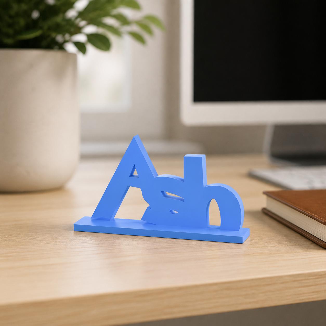 Ash creature adventure personalised nameplate displayed on a modern home-office desk.