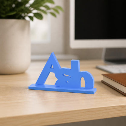 Ash creature adventure personalised nameplate displayed on a modern home-office desk.