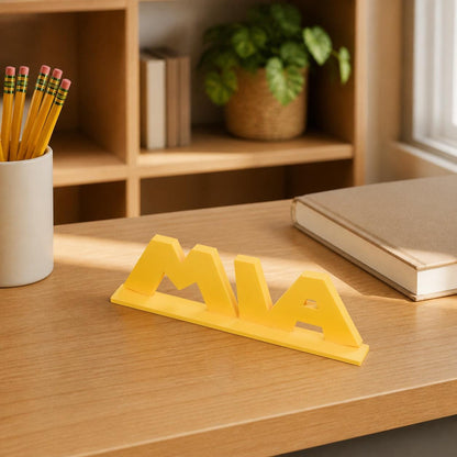 Mia platform adventure personalised nameplate displayed on a teacher's desk.