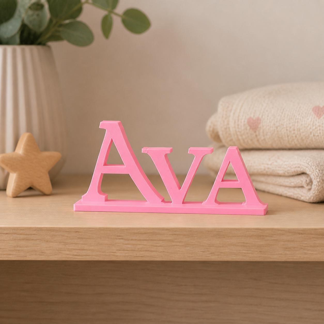 Ava epic fantasy personalised nameplate displayed on a warm neutral nursery shelf.