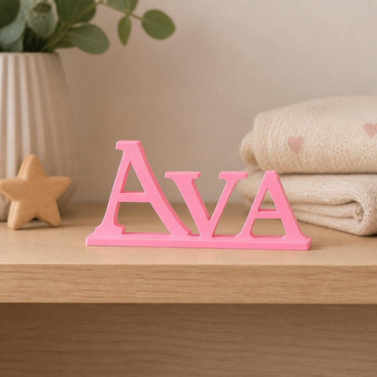 Ava epic fantasy personalised nameplate displayed on a warm neutral nursery shelf.