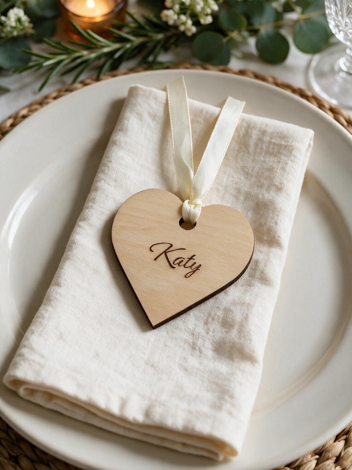 Personalised wooden heart place name styled on a wedding napkin and plate